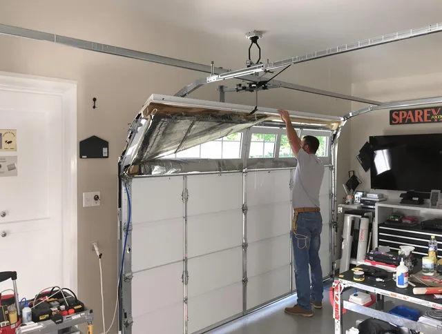 Garage door section replacement by Ledyard Garage Door Repair in Ledyard